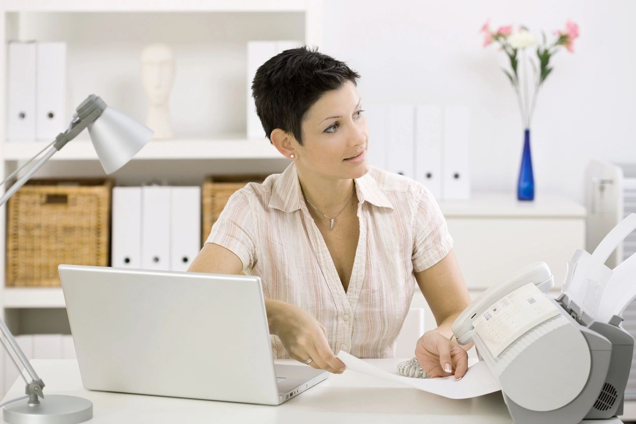 Professional woman working at office laptop